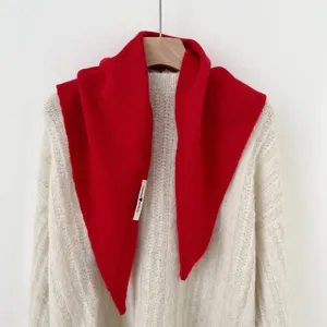 Red knitted triangular scarf for women, cozy wool blend winter fashion warm shawl wrap.