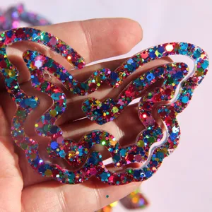 Detailed close-up of a sparkling glitter butterfly resin bookmark showing its vibrant colors.