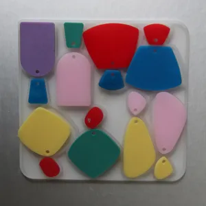 Geometric silicone mold set with colorful resin pendants for DIY handmade earrings creation.