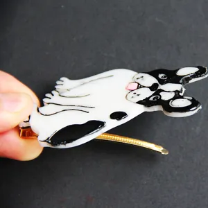 Detailed view of cute black and white French bulldog hair clip with a sturdy metal barrette.