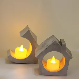 Concrete candle holder set featuring house and moon shapes with warm LED tea light candles.