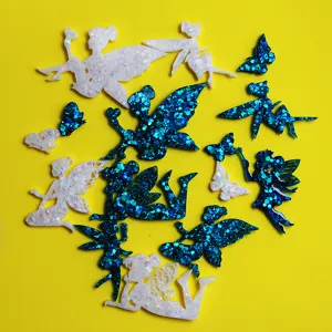 Detailed view of glitter resin fairy charms and craft pieces featuring magical pixie designs.