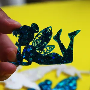 Blue glitter fairy resin craft detail close-up view showing exquisite wing pattern design