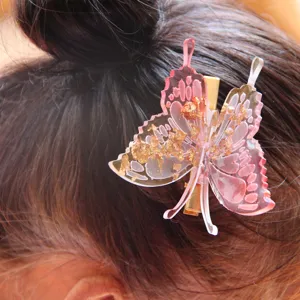Detailed view of a stunning 3D butterfly hair claw clip with gold foil, stylish decor.