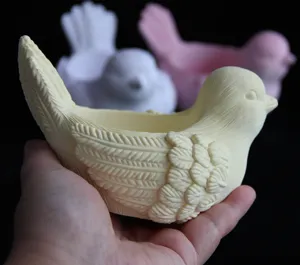Detailed shot of 3D bird shaped container mold, showing delicate feather textures clearly.