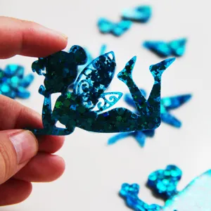 Blue glitter fairy resin craft detail closeup, perfect for DIY keychain making and phone case decor.