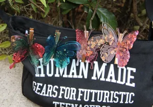 3D butterfly hair clips with sparkling gold foil flakes, stylish resin hair accessories for women.