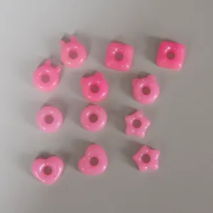 Pink cute resin charms detail with various cute shapes for DIY jewelry craft projects.