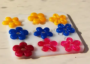 DIY crystal epoxy flower pendant silicone mold set with colorful resin flower charms for craft making.