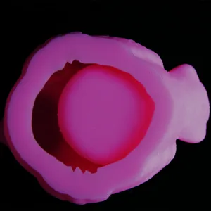 Close up view of the pink silicone mold interior showing the 3D detailed cavity structure.