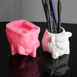Highland cow silicone mold and gypsum pen holder candle cup DIY handmade craft detail view.