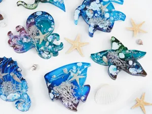 Detailed view of ocean resin animal mold with embedded shells and starfish elements.