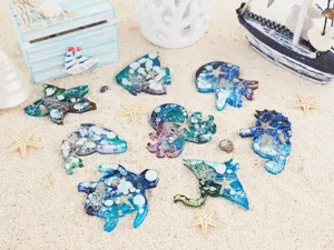 DIY ocean animal epoxy resin mold set featuring jellyfish, octopus, turtle, and whale designs.
