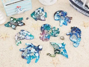 Detailed view of various ocean animal resin crafts featuring starfish and octopus molds.