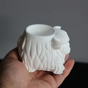 Close-up detail of white highland cow plaster mold showcasing fine animal hair texture and design.