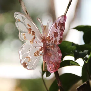 Exquisite 3D resin butterfly hair clip with shimmering gold flakes for elegant daily styling.