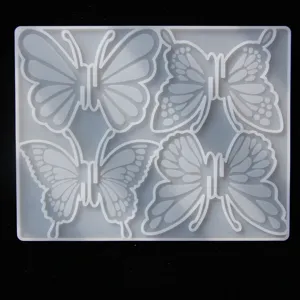 Silicone resin mold detail showing four distinct butterfly designs for DIY hairpin crafting.