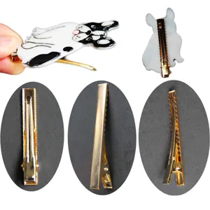 Cute French bulldog hair clip detail view showing enamel finish and sturdy gold metal clasp.