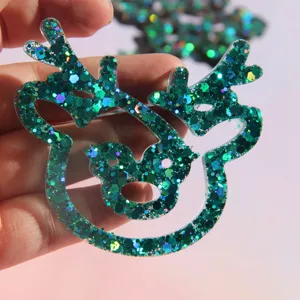 Grünes Glitzer Rentier Detailbild, perfekt für DIY Bastelarbeiten und Weihnachtslesezeichen.