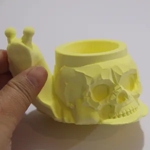 Detailed shot of the creative snail skull planter and pen holder resin mold, unique decor.