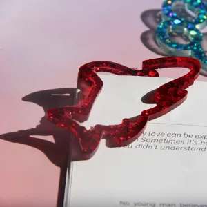 Red glitter resin animal bookmark detail, cute handmade craft silicone mold accessory.