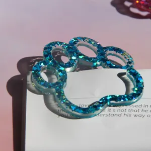 Blue glitter cat paw resin craft detail, sparkling crystal clear cute bookmark or decor piece.