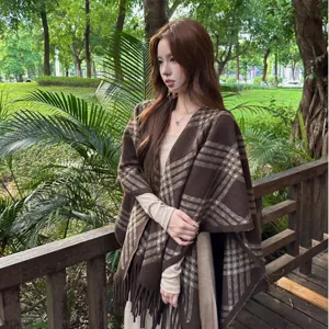 Cozy brown plaid shawl cape for women, featuring soft fringe and stylish autumn design.