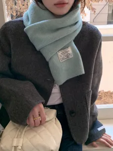Soft blue knitted scarf detail, cozy Korean style winter accessory, warm solid color wrap.