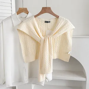 Knit shoulder shawl layered with white shirt minimalist neutral aesthetic daily chic apparel