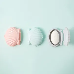 Porte-savon portable en forme de coquillage, égouttoir double couche aux teintes pastel douces.