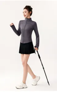 Detailed view of the women's athletic sun protection jacket and skirt set in outdoor style.