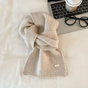 Cozy beige knit scarf for women, soft winter warm thick solid color neck wrap for daily wear.