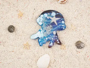 Resin ocean animal jellyfish octopus craft close-up view featuring blue tone and shell details.