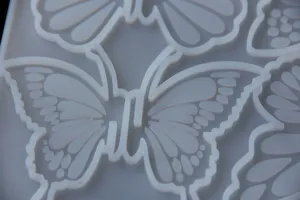Closeup detailed view of butterfly silicone mold showing intricate texture design and clean patterns