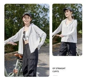 Detail view of grey sun protection hoodie, highlighting straight cuffs and casual outdoor style.