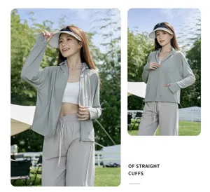 Detailed view of women lightweight grey sun protection hoodie jacket outdoor style.