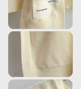 Close-up detail shot of the soft knitted shawl fabric, showing texture and label design.