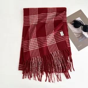 Classic red plaid winter scarf for women, cozy tassel fringe design, warm and stylish neck wrap.