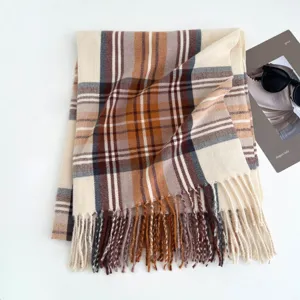 Cozy winter plaid scarf with soft fabric, classic check pattern and fringe details.