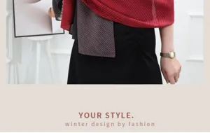 Pleated gradient scarf detail showing soft textured fabric and elegant red and black drape.