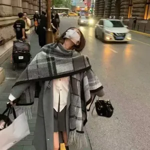 Stylish grey plaid cape scarf for women, elegant autumn fashion accessory and cozy shawl coat.