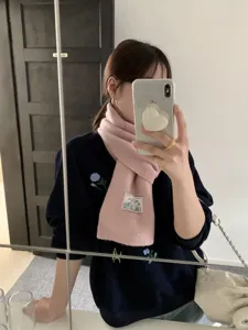 Cozy pink knitted scarf, soft winter warm neck warmer, casual Korean style winter fashion accessory.