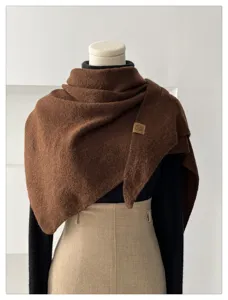 Cozy wool-blend triangular scarf detail showing textured brown drape for women winter warmth.
