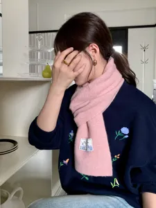 Cozy pink knitted winter scarf for women, soft warm casual daily wear fashion accessory.