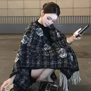 Women fall winter black white plaid tweed cape shawl with floral pattern and fringe design.