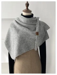 Grey knitted triangular scarf with wool blend, stylish and warm for autumn and winter.