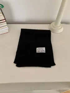 Cozy black knitted winter scarf, soft solid color minimalist warm neck warmer for daily wear.