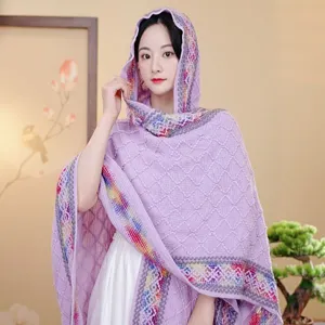 Women's purple hooded knit shawl featuring vibrant ethnic pattern trim for stylish travel wear.