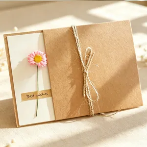 Dried flower kraft paper greeting card detail view, vintage handmade thank you card with pink daisy.