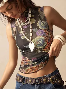 Close-up detail of the floral mesh mock neck sleeveless top showcasing the intricate pattern.